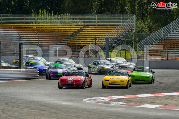 Image of Spec Miata race cars racing at Portland International Raceway in Portland Oregon - Oregon Region SCCA - Northwest Tour