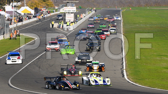 Image of sports cars taking the green flag for the NASA 25 Hours of Thunderhill presented by Hawk Performance, at Thunderhill Raceway Park in Willows, California. National Auto Sports Association.