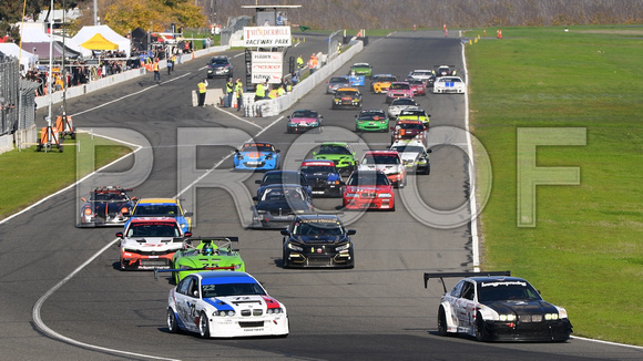 Image of sports cars taking the green flag for the NASA 25 Hours of Thunderhill presented by Hawk Performance, at Thunderhill Raceway Park in Willows, California. National Auto Sports Association.