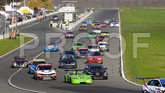 Image of sports cars taking the green flag for the NASA 25 Hours of Thunderhill presented by Hawk Performance, at Thunderhill Raceway Park in Willows, California. National Auto Sports Association.