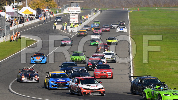Image of sports cars taking the green flag for the NASA 25 Hours of Thunderhill presented by Hawk Performance, at Thunderhill Raceway Park in Willows, California. National Auto Sports Association.