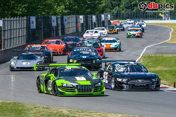 Image of race cars competing in the 2022 FOPIR Rose Cup Races at Portland International Raceway in Portland Oregon..  The 61st Rose Cup Races by Friends of PIR.